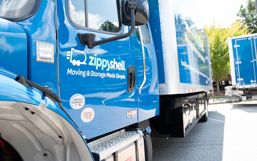Up close view of the door of a blue Zippy Shell moving truck